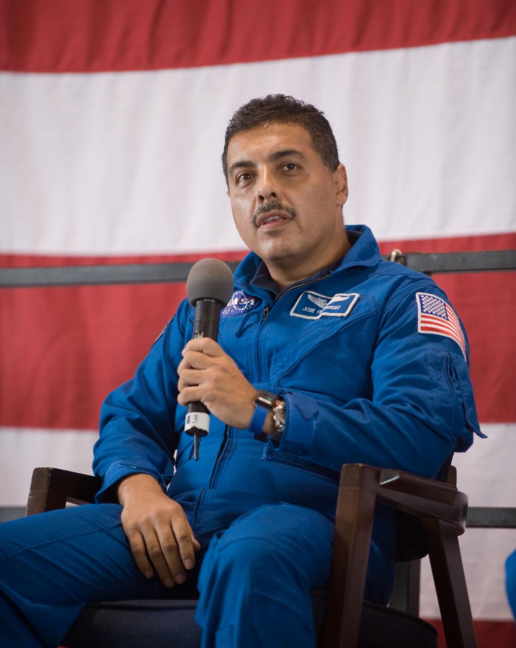 JSC2009-E-207816 (12 Sept. 2009) --- NASA astronaut Jose Hernandez, STS-128 mission specialist, addresses a large crowd of well-wishers at the STS-128 crew return ceremony on Sept. 12, 2009 at Ellington Field near NASA's Johnson Space Center.