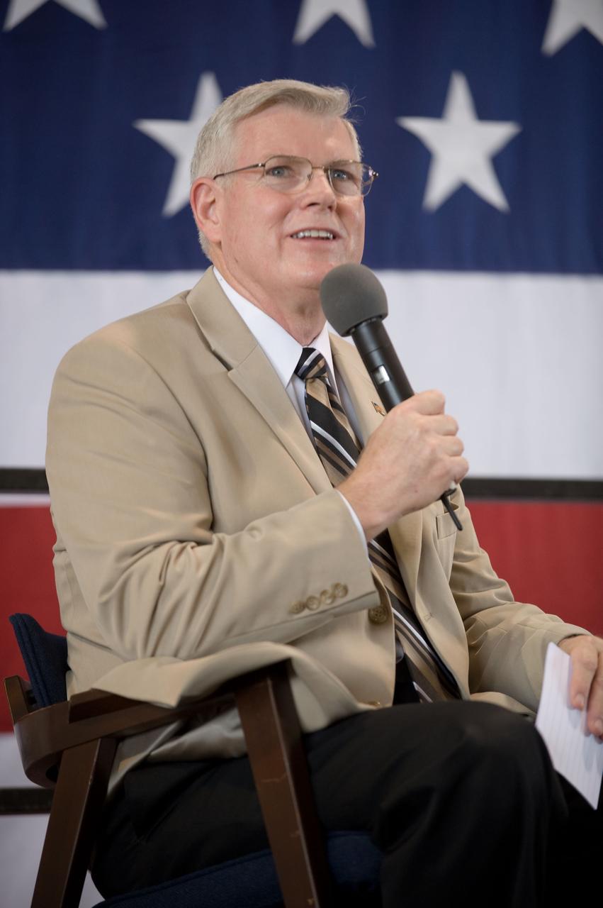JSC2009-E-207839 (12 Sept. 2009) --- NASA's Johnson Space Center (JSC) director Michael L. Coats addresses a large crowd of well-wishers at the STS-128 crew return ceremony on Sept. 12, 2009 at Ellington Field near JSC.