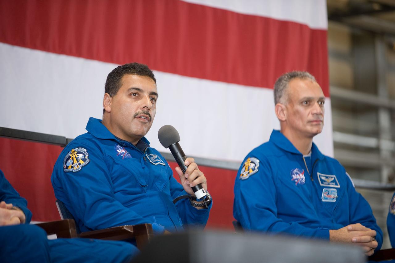 JSC2009-E-207848 (12 Sept. 2009) --- NASA astronaut Jose Hernandez, STS-128 mission specialist, addresses a large crowd of well-wishers at the STS-128 crew return ceremony on Sept. 12, 2009 at Ellington Field near NASA's Johnson Space Center. Astronaut John ?Danny? Olivas, mission specialist, is at right.