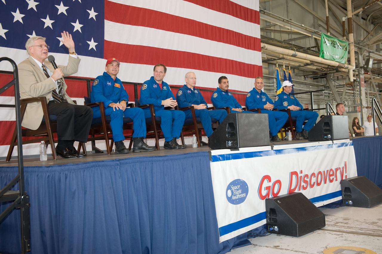 JSC2009-E-207857 (12 Sept. 2009) --- NASA's Johnson Space Center (JSC) director Michael L. Coats addresses a large crowd of well-wishers at the STS-128 crew return ceremony on Sept. 12, 2009 at Ellington Field near JSC. Also pictured (from the second left) are NASA astronauts Rick Sturckow, commander; Kevin Ford, pilot; Patrick Forrester, Jose Hernandez, John ?Danny? Olivas and European Space Agency astronaut Christer Fuglesang, all mission specialists.