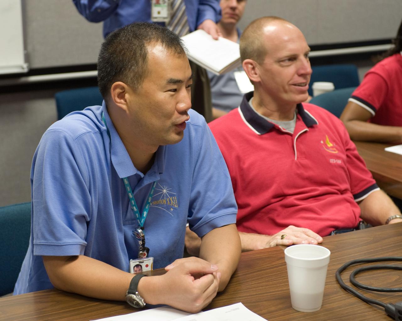 JSC2009-E-207880 (15 Sept. 2009) --- Japan Aerospace Exploration Agency (JAXA) astronaut Soichi Noguchi (left), Expedition 22/23 flight engineer; and NASA astronaut Clay Anderson, STS-131 mission specialist, participate in a training session in the Space Vehicle Mock-up Facility at NASA's Johnson Space Center.