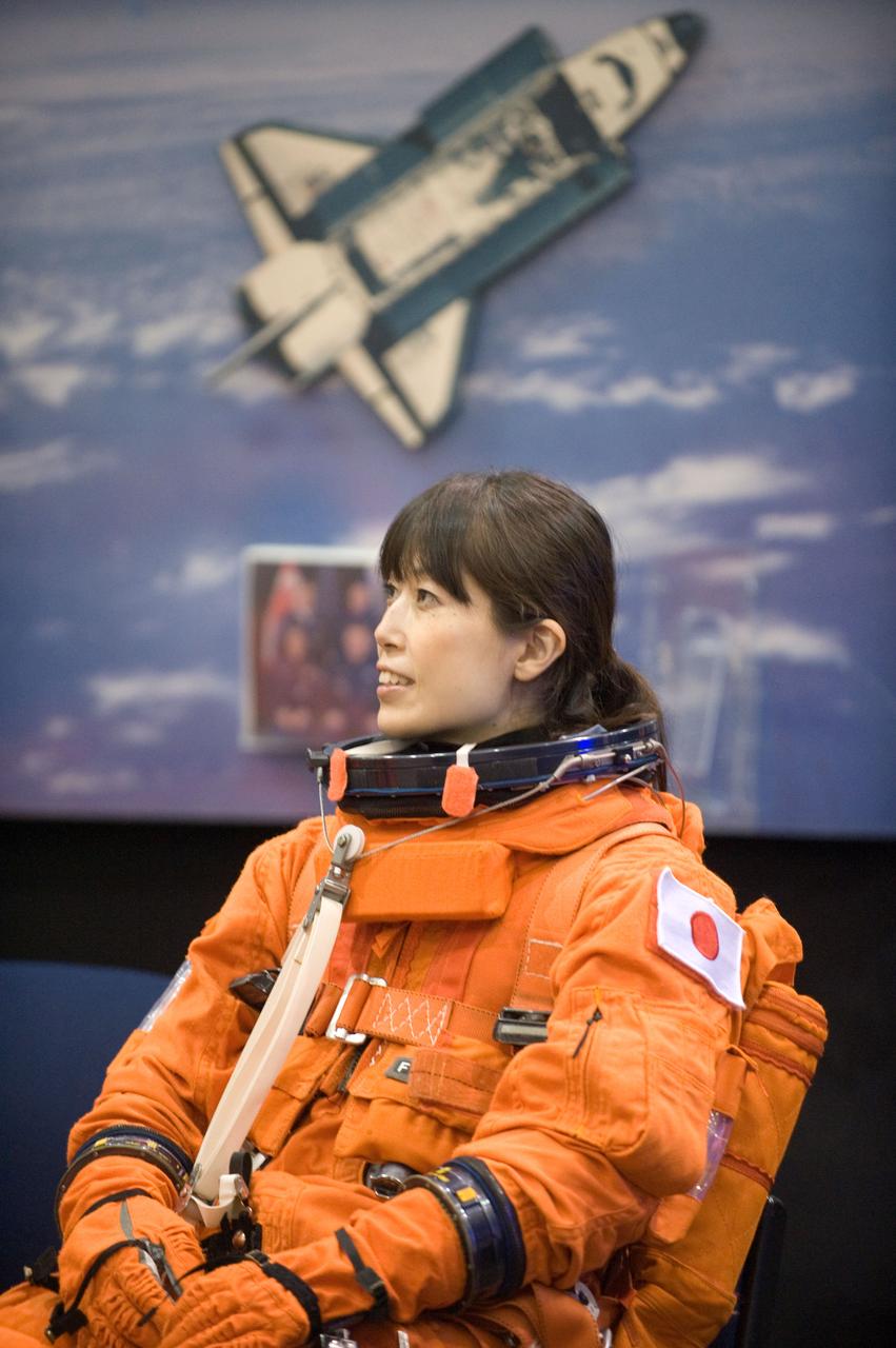 JSC2009-E-207936 (14 Sept. 2009) --- Japan Aerospace Exploration Agency (JAXA) astronaut Naoko Yamazaki, STS-131 mission specialist, attired in a training version of her shuttle launch and entry suit, awaits the start of a training session in the Space Vehicle Mock-up Facility at NASA's Johnson Space Center.