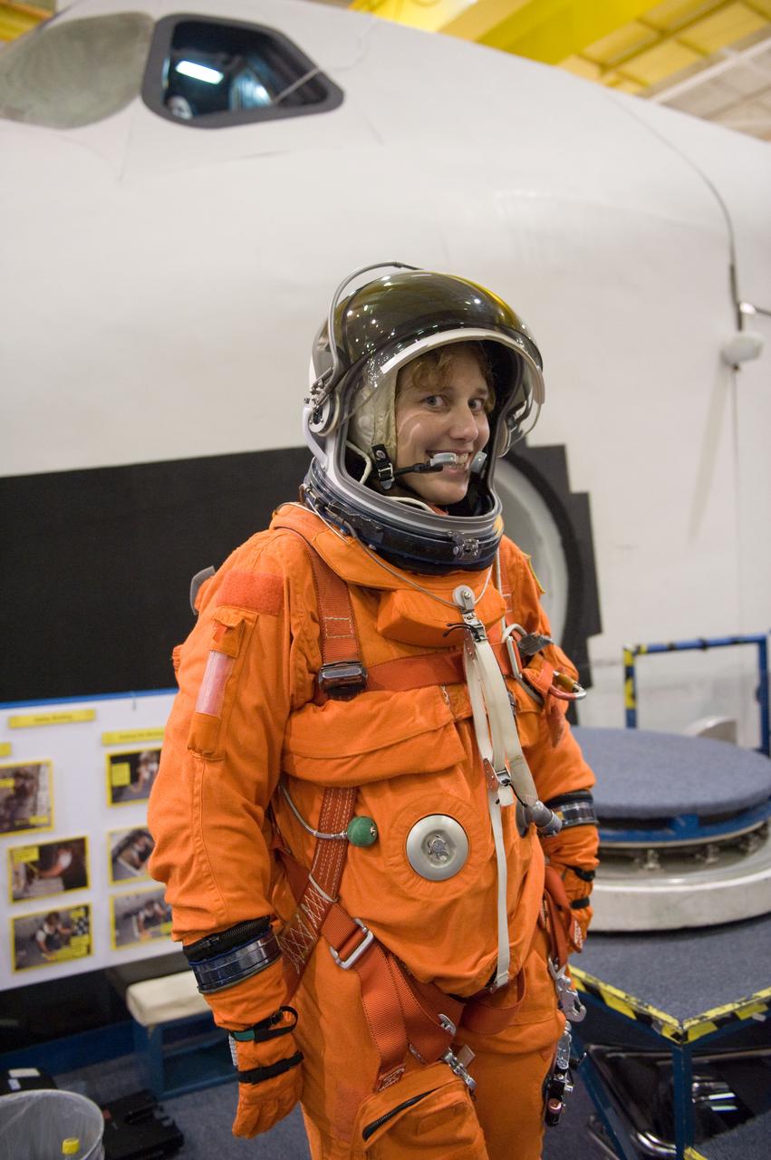JSC2009-E-207960 (14 Sept. 2009) --- NASA astronaut Dorothy Metcalf-Lindenburger, STS-131 mission specialist, attired in a training version of her shuttle launch and entry suit, participates in a training session in the Space Vehicle Mock-up Facility at NASA's Johnson Space Center.