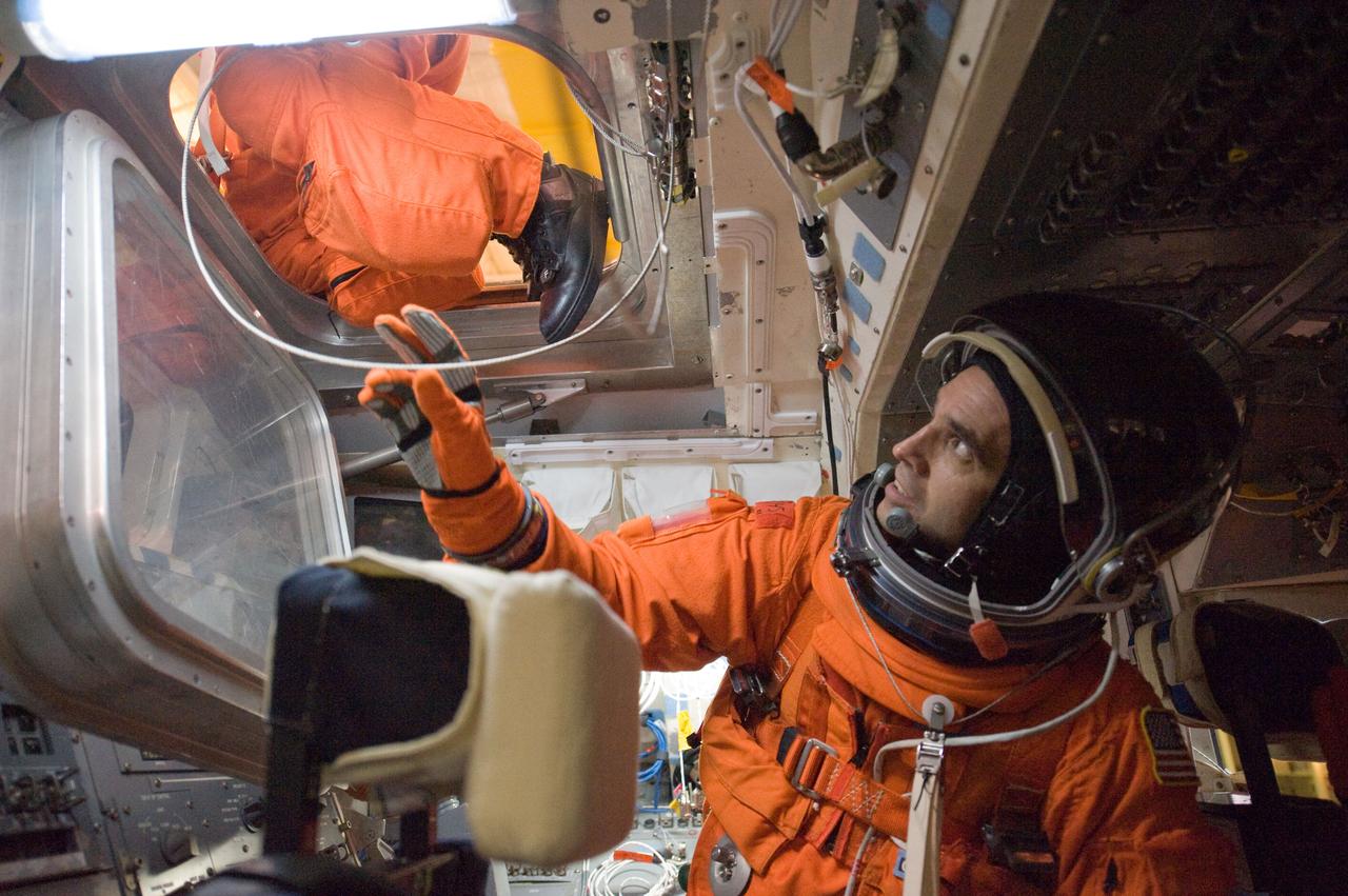 JSC2009-E-207983 (14 Sept. 2009) --- NASA astronaut Rick Mastracchio, STS-131 mission specialist, attired in a training version of his shuttle launch and entry suit, participates in a training session in one of the full-scale trainers in the Space Vehicle Mock-up Facility at NASA's Johnson Space Center.