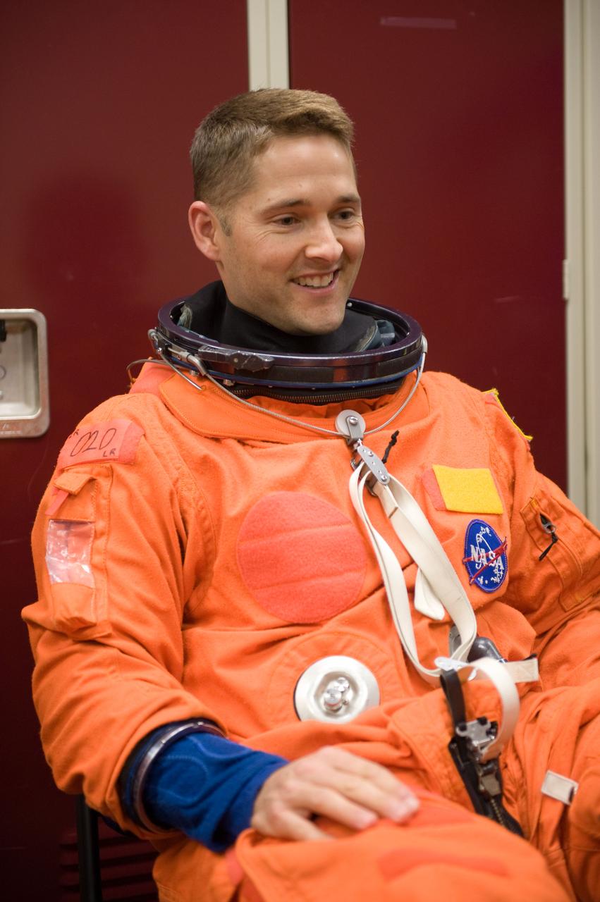 JSC2009-E-208004 (14 Sept. 2009) --- NASA astronaut James P. Dutton Jr., STS-131 pilot, attired in a training version of his shuttle launch and entry suit, awaits the start of a training session in the Space Vehicle Mock-up Facility at NASA's Johnson Space Center.