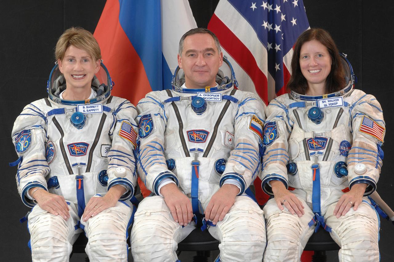 JSC2009-E-208079 (31 Aug. 2009) --- Attired in Russian Sokol launch and entry suits, backup spaceflight participant Barbara Barrett (left); Russian cosmonaut Alexander Skvortsov, backup Soyuz commander and Expedition 21 flight engineer; and NASA astronaut Shannon Walker, backup Expedition 21 commander and flight engineer, take a break from training in Star City, Russia to pose for a portrait. Photo credit: Gagarin Cosmonaut Training Center