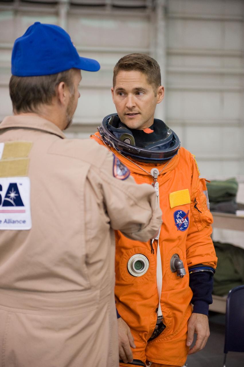JSC2009-E-208855 (17 Sept. 2009) --- NASA astronaut James P. Dutton Jr., STS-131 pilot, attired in a training version of his shuttle launch and entry suit, participates in a water survival training session in the Neutral Buoyancy Laboratory (NBL) near NASA's Johnson Space Center.