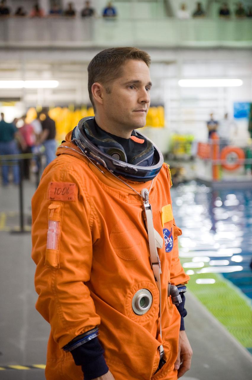 JSC2009-E-208856 (17 Sept. 2009) --- NASA astronaut James P. Dutton Jr., STS-131 pilot, attired in a training version of his shuttle launch and entry suit, participates in a water survival training session in the Neutral Buoyancy Laboratory (NBL) near NASA's Johnson Space Center.