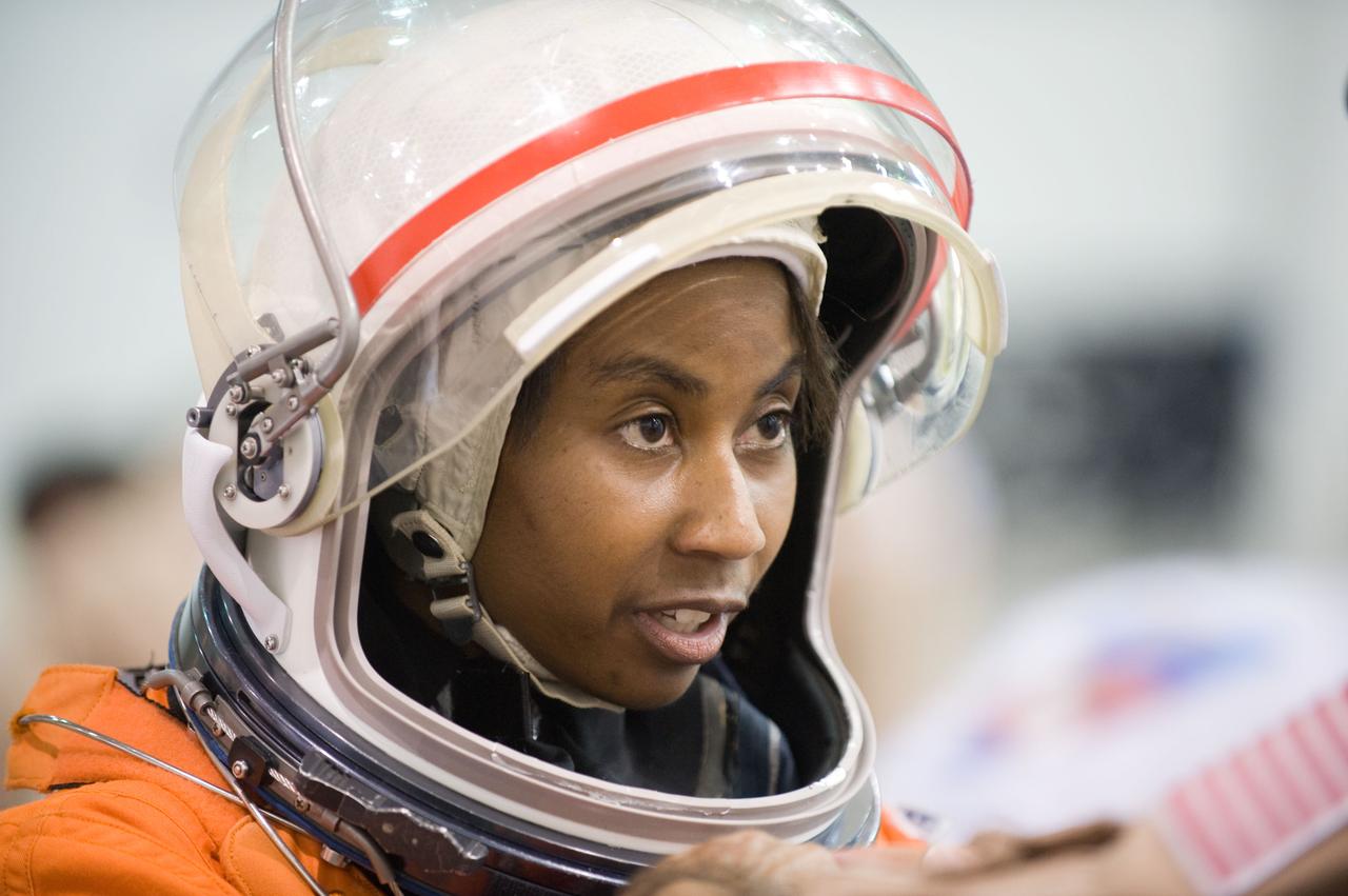 JSC2009-E-208906 (17 Sept. 2009) --- NASA astronaut Stephanie Wilson, STS-131 mission specialist, attired in a training version of her shuttle launch and entry suit, participates in a water survival training session in the Neutral Buoyancy Laboratory (NBL) near NASA's Johnson Space Center.