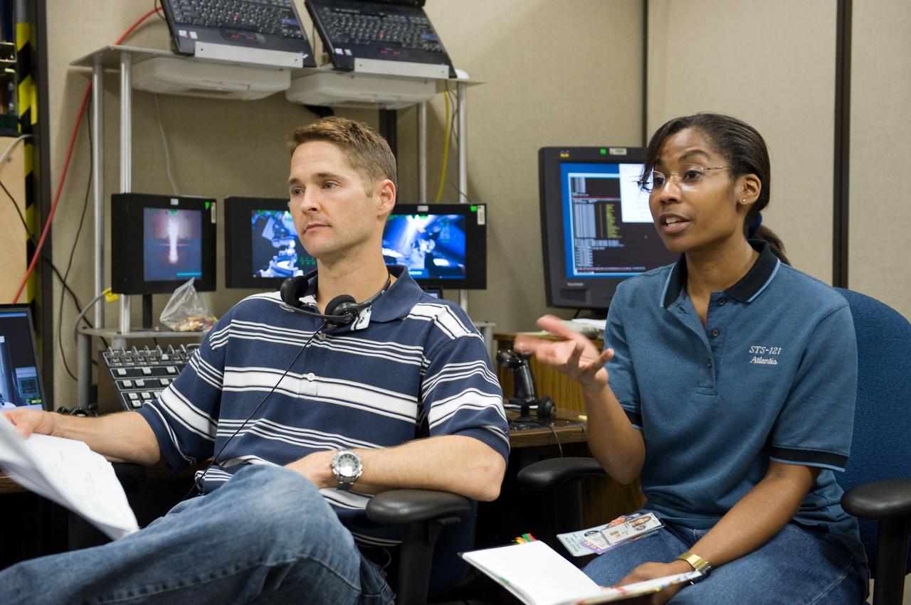 JSC2009-E-214324 (25 Sept. 2009) --- NASA astronauts James P. Dutton Jr., STS-131 pilot; and Stephanie Wilson, mission specialist, are pictured during a training session in the virtual reality lab in the Space Vehicle Mock-up Facility at NASA's Johnson Space Center to train for some of their duties aboard the space shuttle and space station.