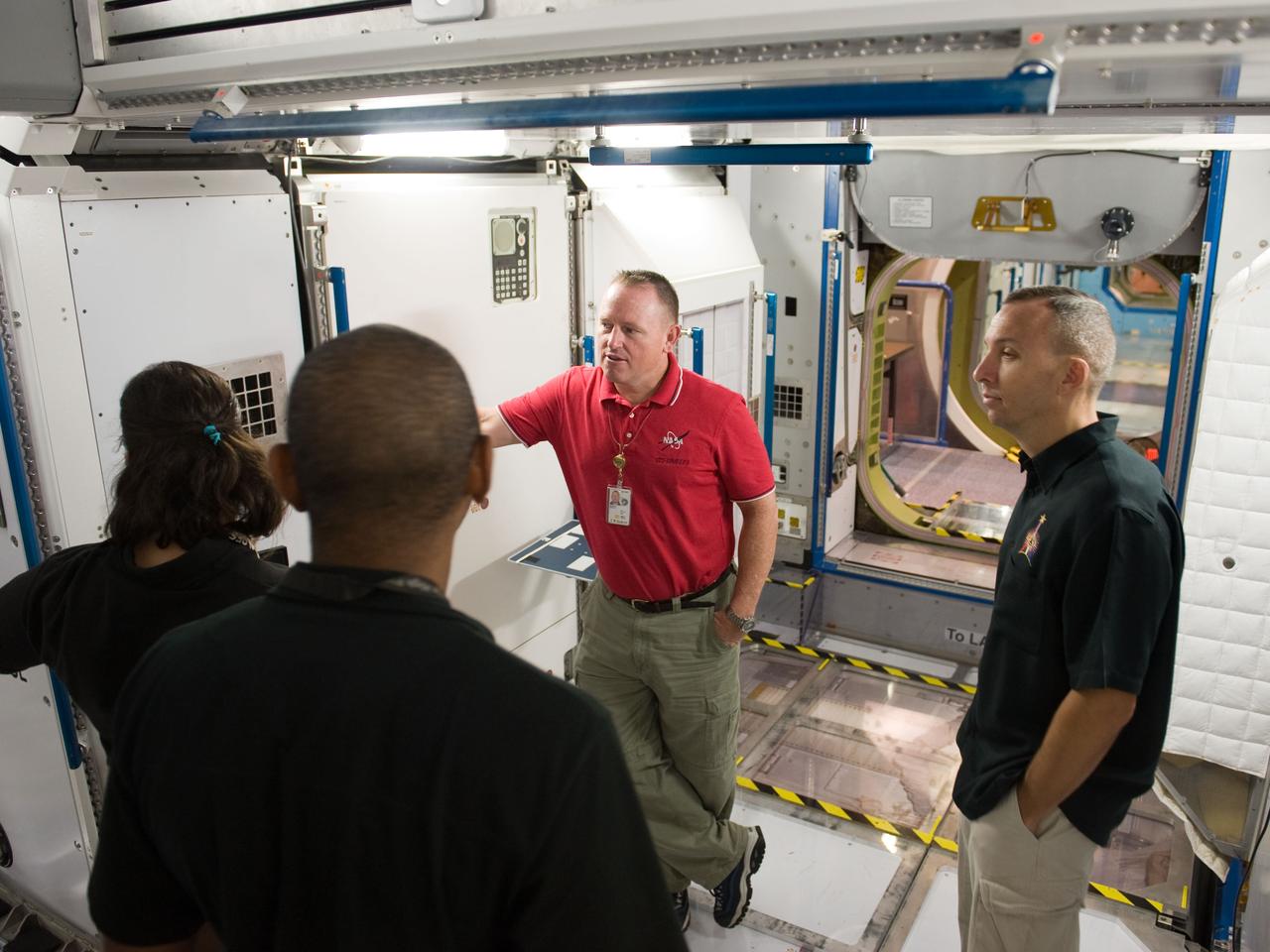 PHOTO DATE:  09-28-09 LOCATION:  Bldg 9NW, ISS Mockups SUBJECT:   STS-129 crew during trans hands-on review in the space station mockups. PHOTOGRAPHER:  James Blair