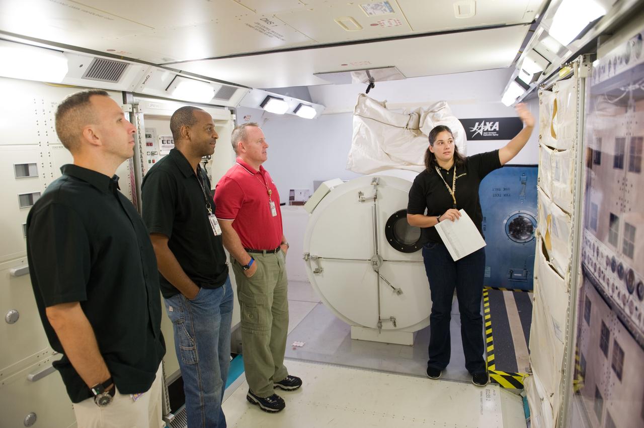 PHOTO DATE:  09-28-09 LOCATION:  Bldg 9NW, ISS Mockups SUBJECT:   STS-129 crew during trans hands-on review in the space station mockups. PHOTOGRAPHER:  James Blair
