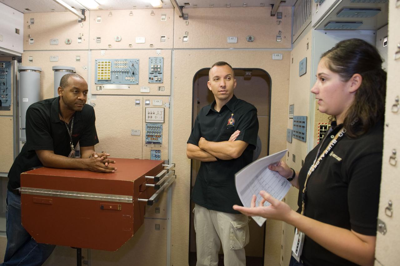 PHOTO DATE:  09-28-09 LOCATION:  Bldg 9NW, ISS Mockups SUBJECT:   STS-129 crew during trans hands-on review in the space station mockups. PHOTOGRAPHER:  James Blair