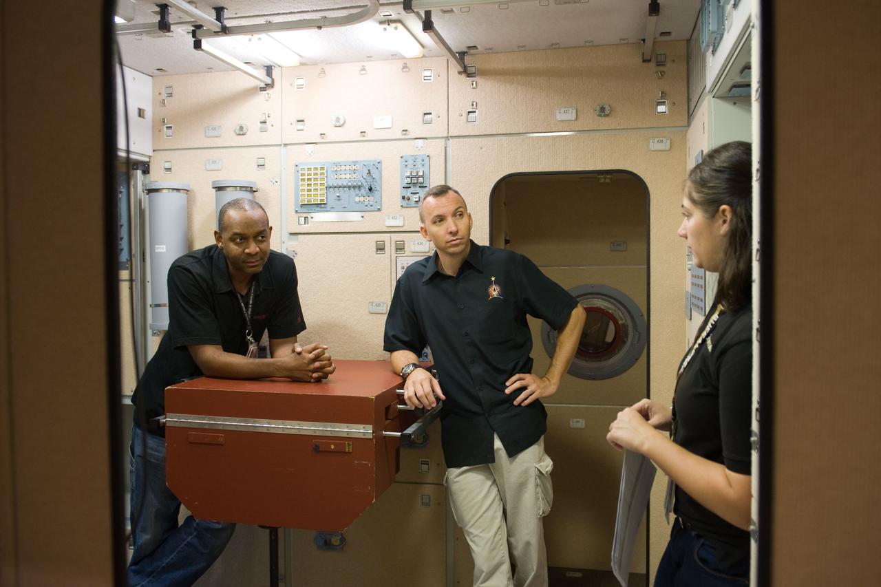 PHOTO DATE:  09-28-09 LOCATION:  Bldg 9NW, ISS Mockups SUBJECT:   STS-129 crew during trans hands-on review in the space station mockups. PHOTOGRAPHER:  James Blair