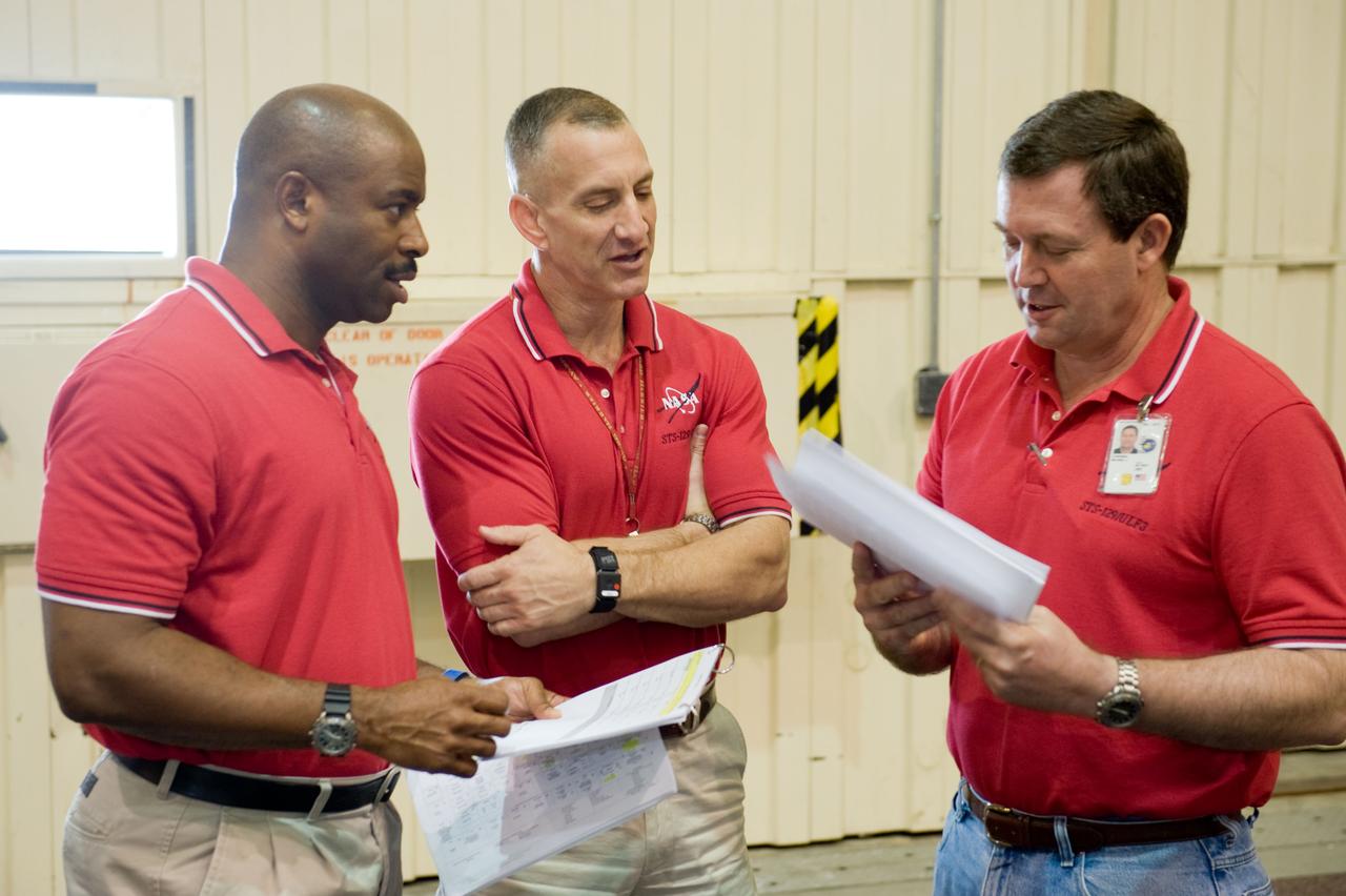 PHOTO DATE:  09-28-09 LOCATION:  Bldg 9NW, ISS Mockups SUBJECT:   STS-129 crew during trans hands-on review in the space station mockups. PHOTOGRAPHER:  James Blair