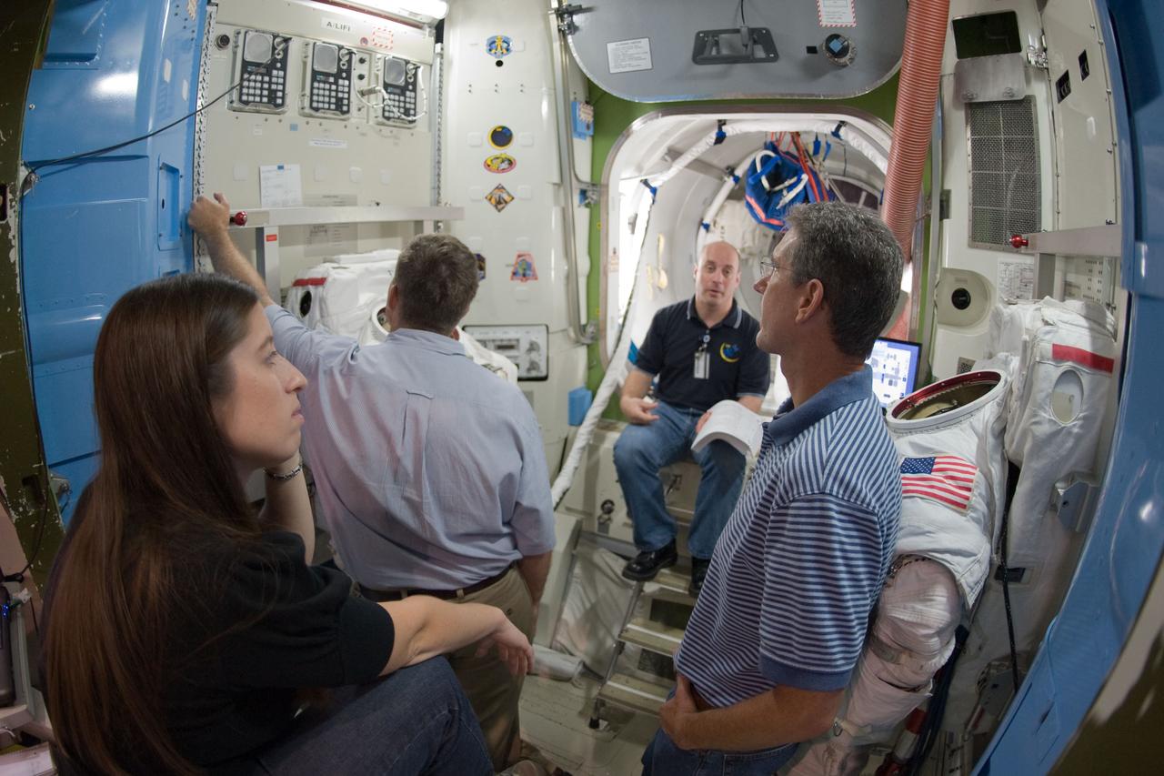 JSC2009-E-214810 (29 Sept. 2009) --- Astronauts Mike Good (foreground), Steve Bowen (left and Garrett Reisman, all STS-132 mission specialists, participate in a training session in an International Space Station mock-up/trainer in the Space Vehicle Mock-up Facility at NASA's Johnson Space Center.