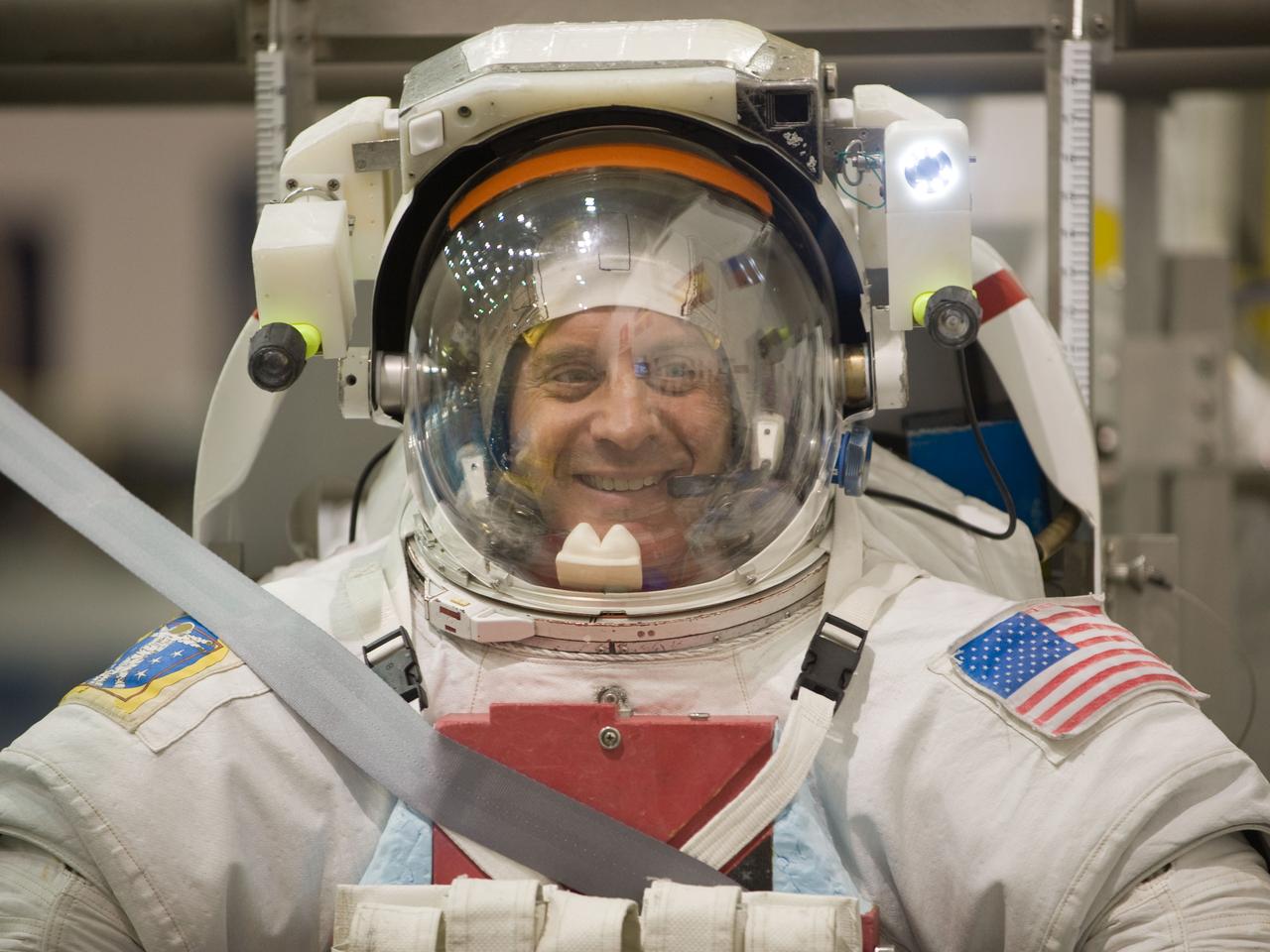JSC2009-E-215164 (30 Sept. 2009) --- Attired in a training version of his Extravehicular Mobility Unit (EMU) spacesuit, astronaut Garrett Reisman, STS-132 mission specialist, awaits the start of a spacewalk training session in the waters of the Neutral Buoyancy Laboratory (NBL) near NASA's Johnson Space Center.