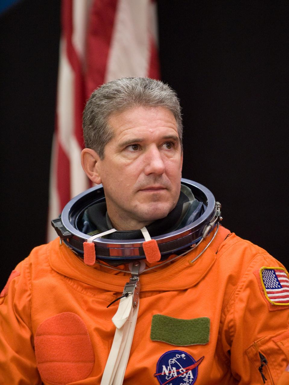 JSC2009-E-224124 (20 Oct. 2009) --- Astronaut Mike Good, STS-132 mission specialist, attired in a training version of his shuttle launch and entry suit, awaits the start of a training session in the Space Vehicle Mock-up Facility at NASA?s Johnson Space Center.