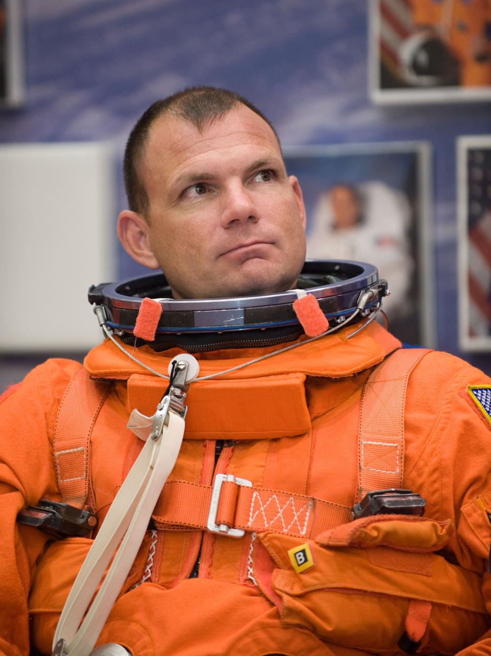 JSC2009-E-224125 (20 Oct. 2009) --- Astronaut Tony Antonelli, STS-132 pilot, attired in a training version of his shuttle launch and entry suit, awaits the start of a training session in the Space Vehicle Mock-up Facility at NASA?s Johnson Space Center.