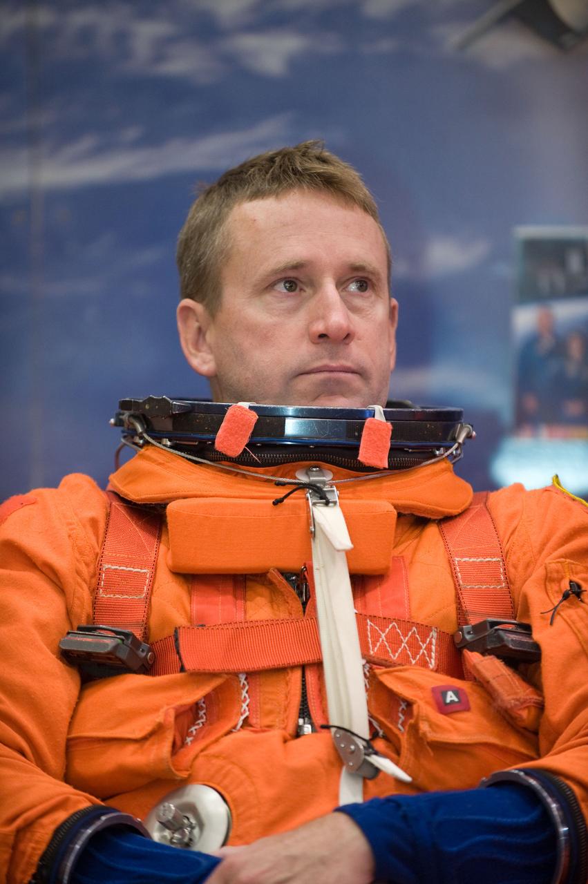 JSC2009-E-224127 (20 Oct. 2009) --- Astronaut Ken Ham, STS-132 commander, attired in a training version of his shuttle launch and entry suit, awaits the start of a training session in the Space Vehicle Mock-up Facility at NASA?s Johnson Space Center.