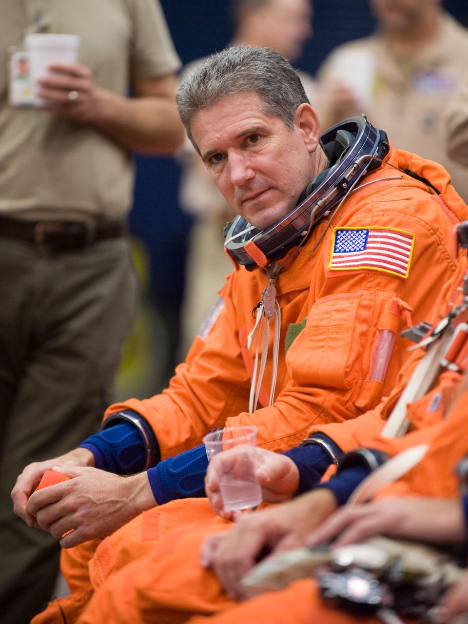JSC2009-E-224130 (20 Oct. 2009) --- Astronaut Mike Good, STS-132 mission specialist, attired in a training version of his shuttle launch and entry suit, awaits the start of a training session in the Space Vehicle Mock-up Facility at NASA?s Johnson Space Center.