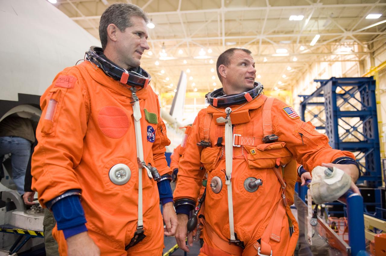 JSC2009-E-224136 (20 Oct. 2009) --- Astronaut Tony Antonelli (right), STS-132 pilot; and Mike Good, mission specialist, attired in training versions of their shuttle launch and entry suit, participate in a training session in the Space Vehicle Mock-up Facility at NASA?s Johnson Space Center.