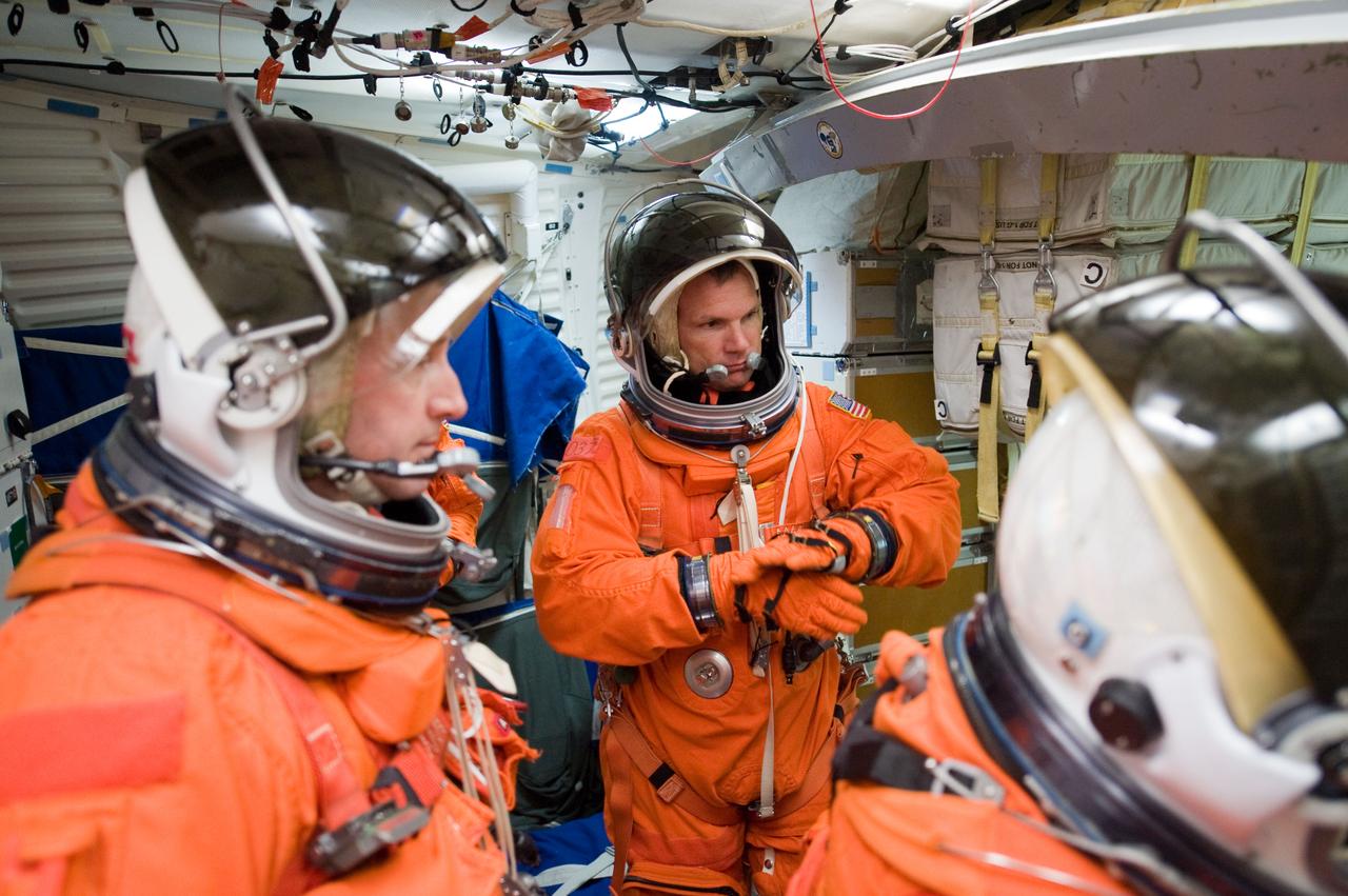 JSC2009-E-224172 (20 Oct. 2009) --- Attired in training versions of their shuttle launch and entry suits, astronauts Ken Ham (left), STS-132 commander; and Tony Antonelli, pilot, are pictured during a training session in one of the full-scale trainers in the Space Vehicle Mock-up Facility at NASA's Johnson Space Center.