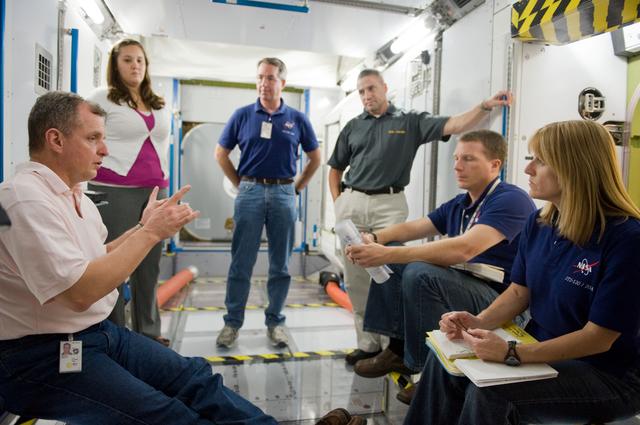 NASA image: STS-130 crew and Expedition 22 crew member T.J. Creamer during module outfitting training. 