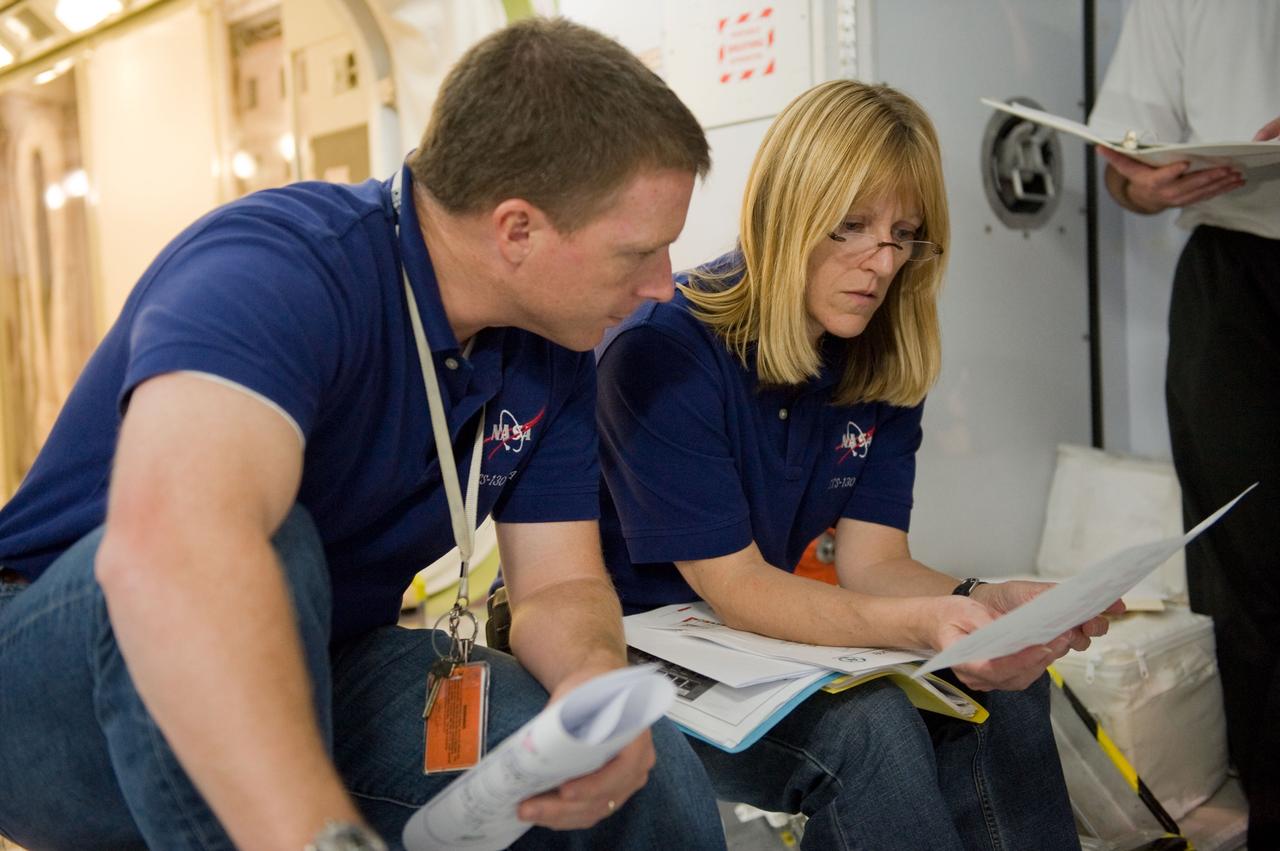 JSC2009-E-224177 (7 Oct. 2009) --- Astronauts Terry Virts, STS-130 pilot; and Kathryn Hire, mission specialist, participate in a training session in an International Space Station mock-up/trainer in the Space Vehicle Mock-up Facility at NASA's Johnson Space Center.