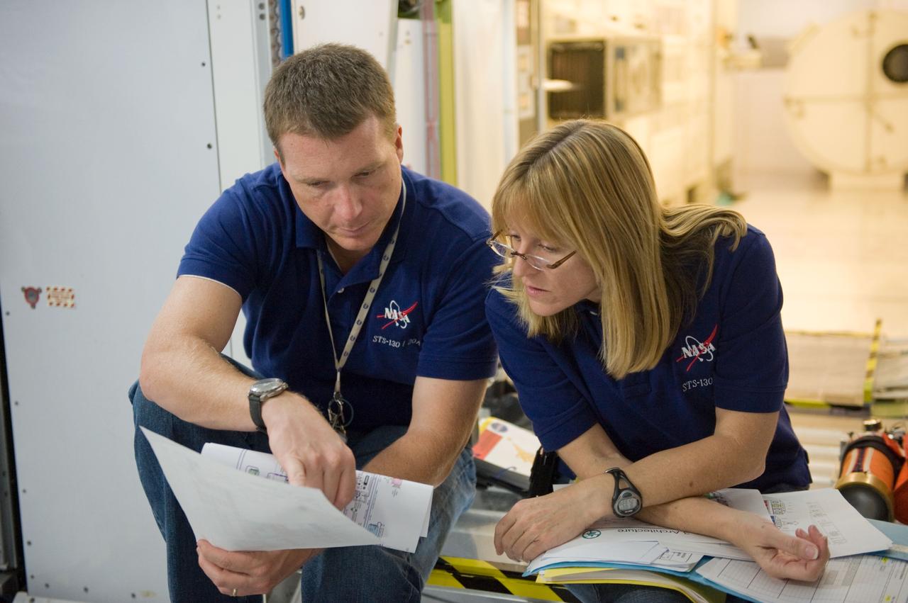 JSC2009-E-224181 (7 Oct. 2009) --- Astronauts Terry Virts, STS-130 pilot; and Kathryn Hire, mission specialist, participate in a training session in an International Space Station mock-up/trainer in the Space Vehicle Mock-up Facility at NASA's Johnson Space Center.