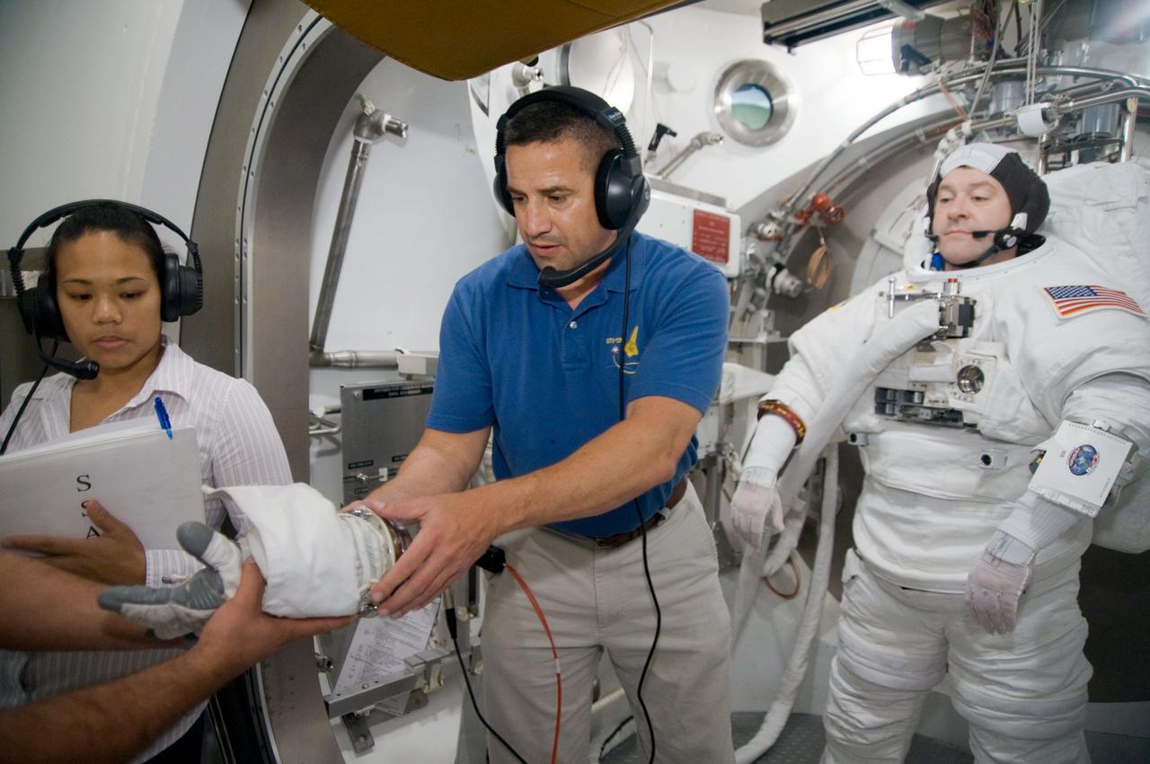 STS-130 astronaut Nick Patrick during dry run for SSATA Crew Training and EMU Verification for STS-130. Photo Date: October 29, 2009.  Location: Building 7 - SSATA Chamber.  Photographer: Robert Markowitz.