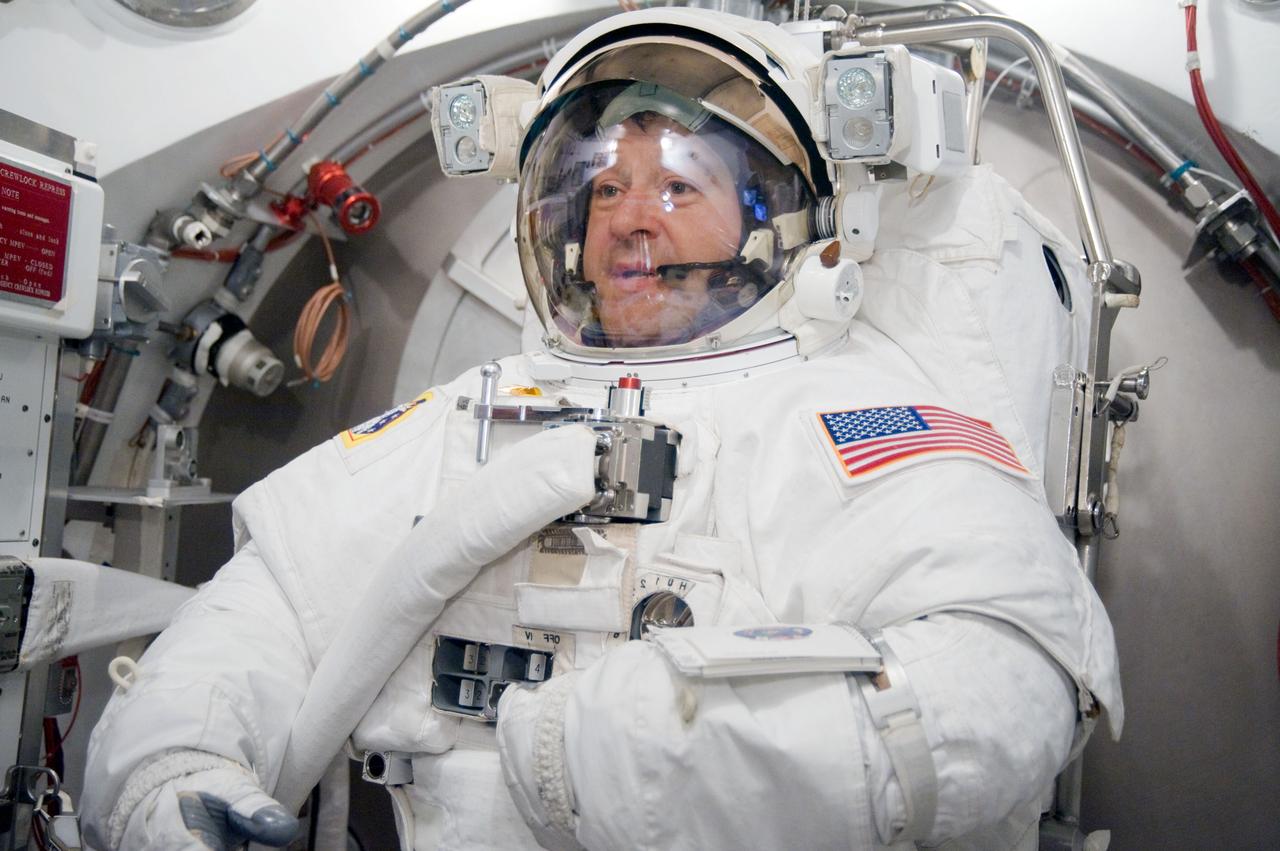 JSC2009-E-228759 (29 Oct. 2009) --- Astronaut Nicholas Patrick, STS-130 mission specialist, participates in an Extravehicular Mobility Unit (EMU) spacesuit fit check in the Space Station Airlock Test Article (SSATA) in the Crew Systems Laboratory at NASA's Johnson Space Center.