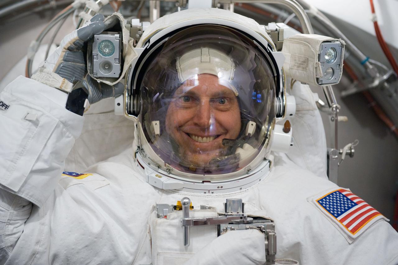 JSC2009-E-240509 (5 Nov. 2009) --- Astronaut Clayton Anderson, STS-131 mission specialist, participates in an Extravehicular Mobility Unit (EMU) spacesuit fit check in the Space Station Airlock Test Article (SSATA) in the Crew Systems Laboratory at NASA's Johnson Space Center.