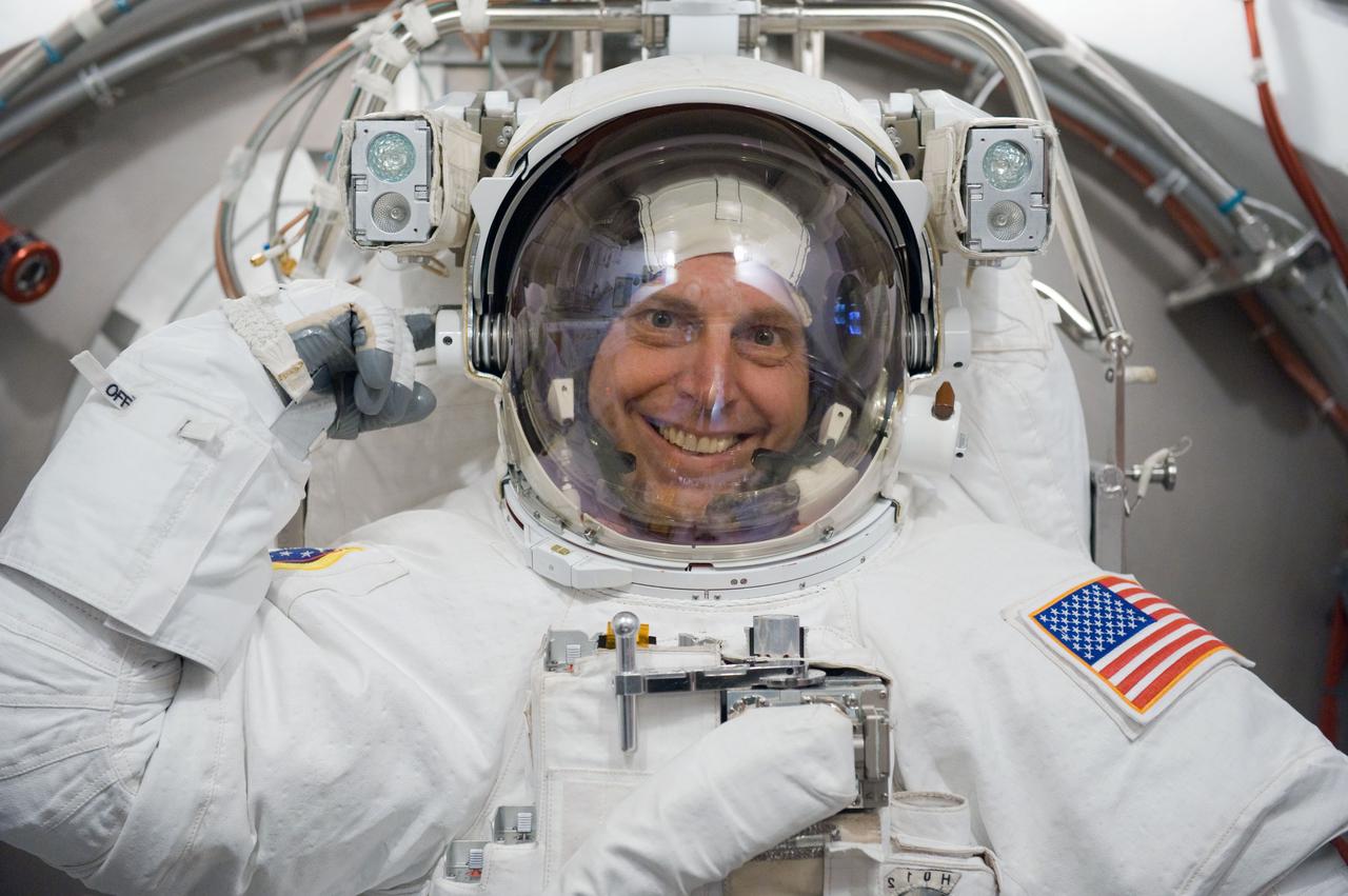 JSC2009-E-240514 (5 Nov. 2009) --- Astronaut Clayton Anderson, STS-131 mission specialist, participates in an Extravehicular Mobility Unit (EMU) spacesuit fit check in the Space Station Airlock Test Article (SSATA) in the Crew Systems Laboratory at NASA's Johnson Space Center.