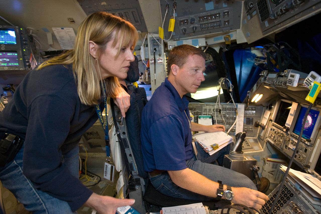 JSC2009-E-240767 (12 Nov. 2009) --- Astronauts Terry Virts, STS-130 pilot; and Kathryn Hire, mission specialist, participate in a training session in the fixed-base shuttle mission simulator (SMS) in the Jake Garn Simulation and Training Facility at Johnson Space Center.