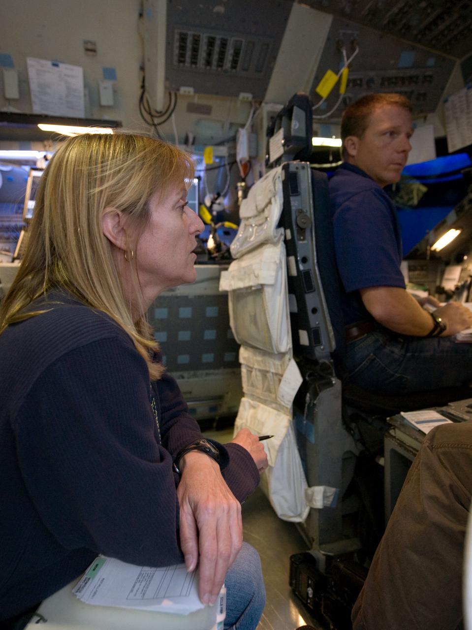 JSC2009-E-240768 (12 Nov. 2009) --- Astronauts Terry Virts, STS-130 pilot; and Kathryn Hire, mission specialist, participate in a training session in the fixed-base shuttle mission simulator (SMS) in the Jake Garn Simulation and Training Facility at Johnson Space Center.