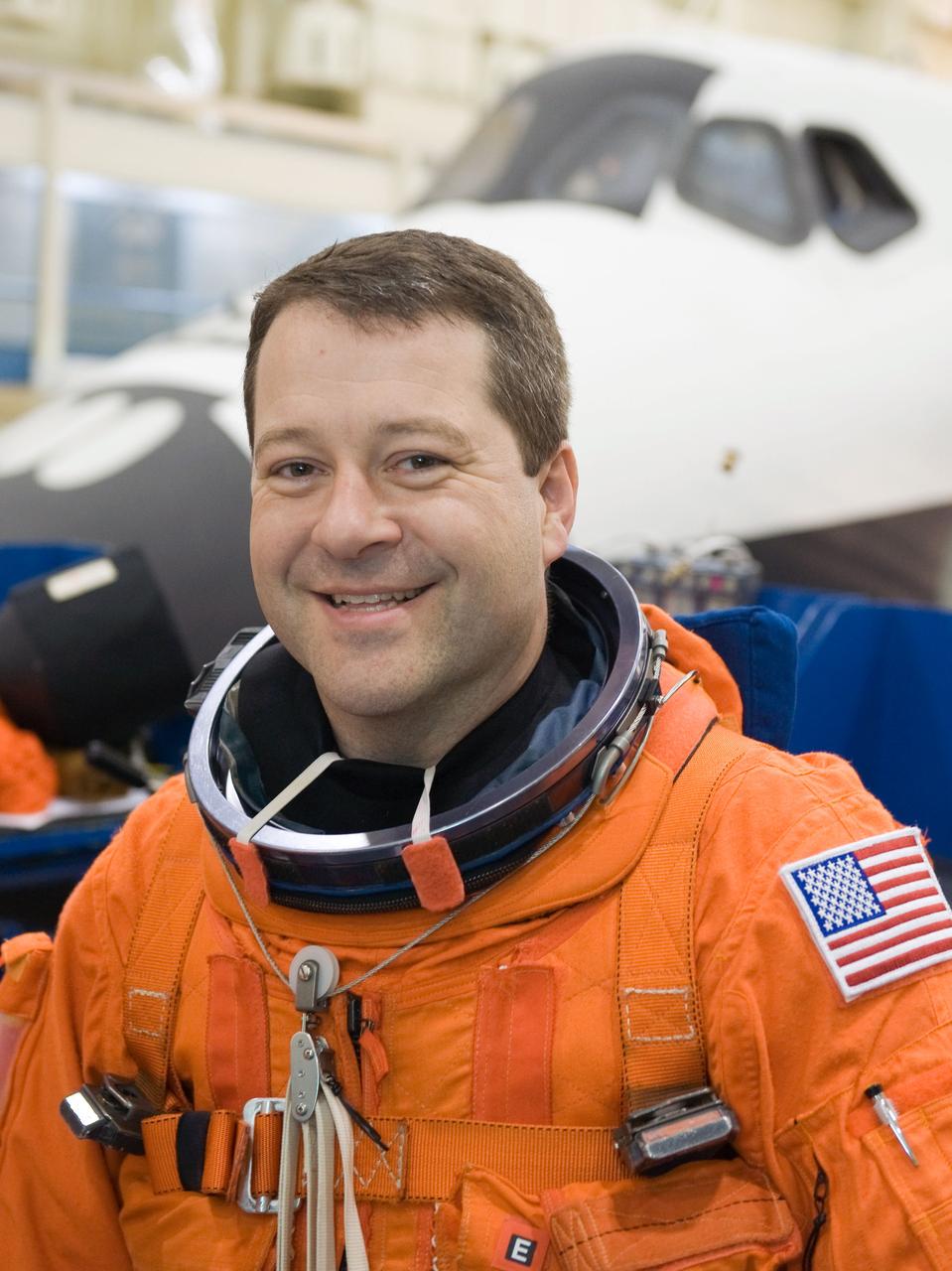 JSC2009-E-242839 (19 Nov. 2009) --- Astronaut Nicholas Patrick, STS-130 mission specialist, attired in a training version of his shuttle launch and entry suit, is pictured during a training session in the Space Vehicle Mockup Facility at NASA's Johnson Space Center.