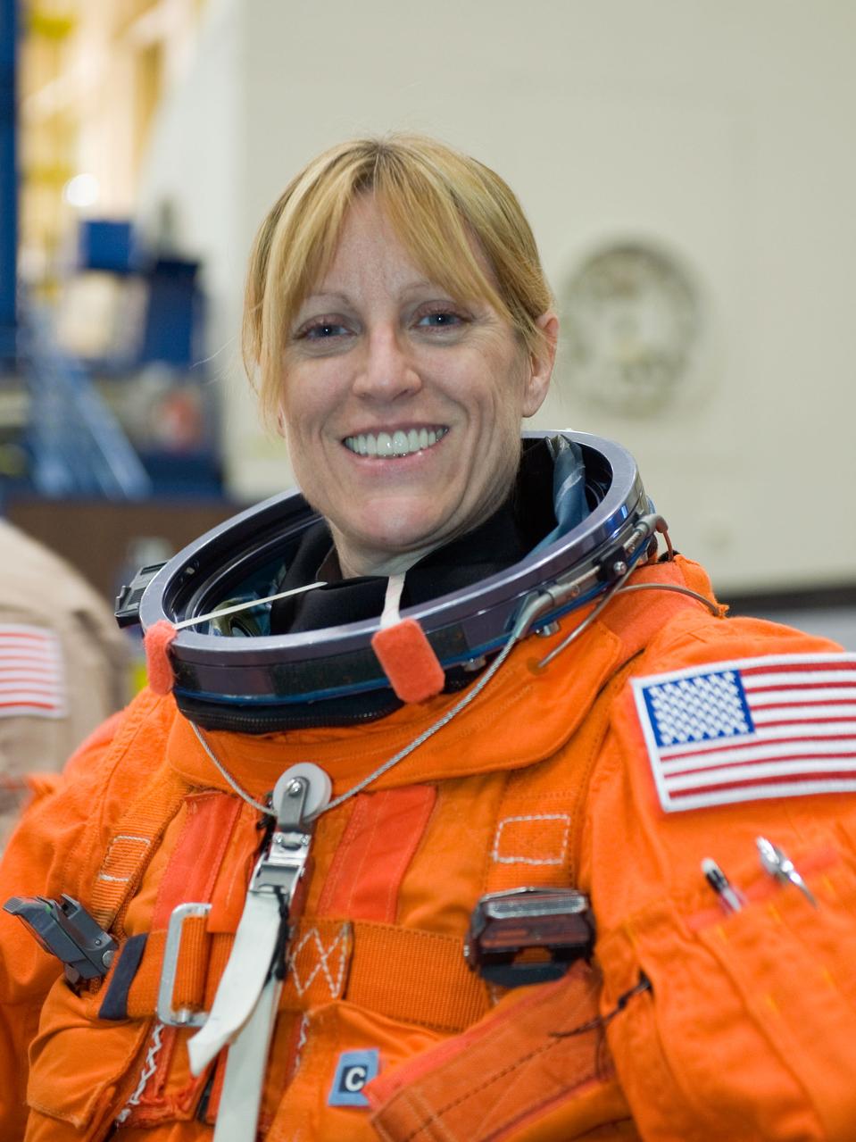 JSC2009-E-242840 (19 Nov. 2009) --- Astronaut Kathryn Hire, STS-130 mission specialist, attired in a training version of her shuttle launch and entry suit, is pictured during a training session in the Space Vehicle Mockup Facility at NASA's Johnson Space Center.