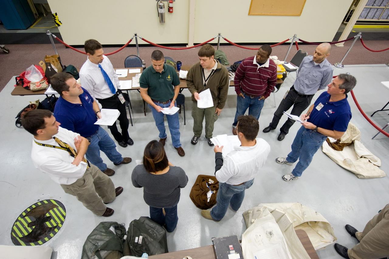 JSC2009-E-244201 (23 Nov. 2009) --- STS-130 crew members along with crew instructors are pictured during a training session in the Space Vehicle Mockup Facility at NASA's Johnson Space Center. Crew members pictured are George Zamka, commander; Nicholas Patrick, Robert Behnken and Stephen Robinson, all mission specialists.