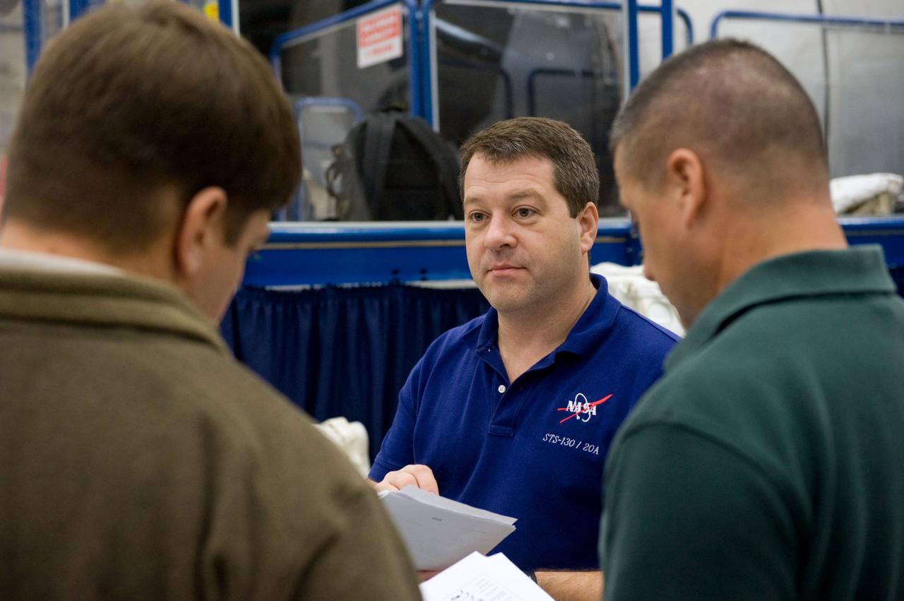 JSC2009-E-244210 (23 Nov. 2009) --- Astronaut George Zamka (right), STS-130 commander; along with astronauts Nicholas Patrick (center) and Robert Behnken, both mission specialists, participate in a training session in the Space Vehicle Mockup Facility at NASA's Johnson Space Center.