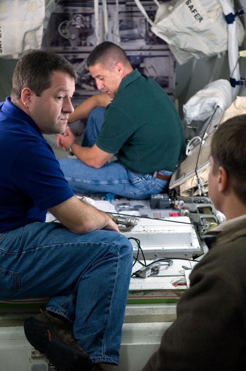 JSC2009-E-244219 (23 Nov. 2009) --- Astronaut George Zamka (background), STS-130 commander; along with astronauts Nicholas Patrick (left) and Robert Behnken, both mission specialists, participate in a training session in an International Space Station mock-up/trainer in the Space Vehicle Mock-up Facility at NASA's Johnson Space Center.