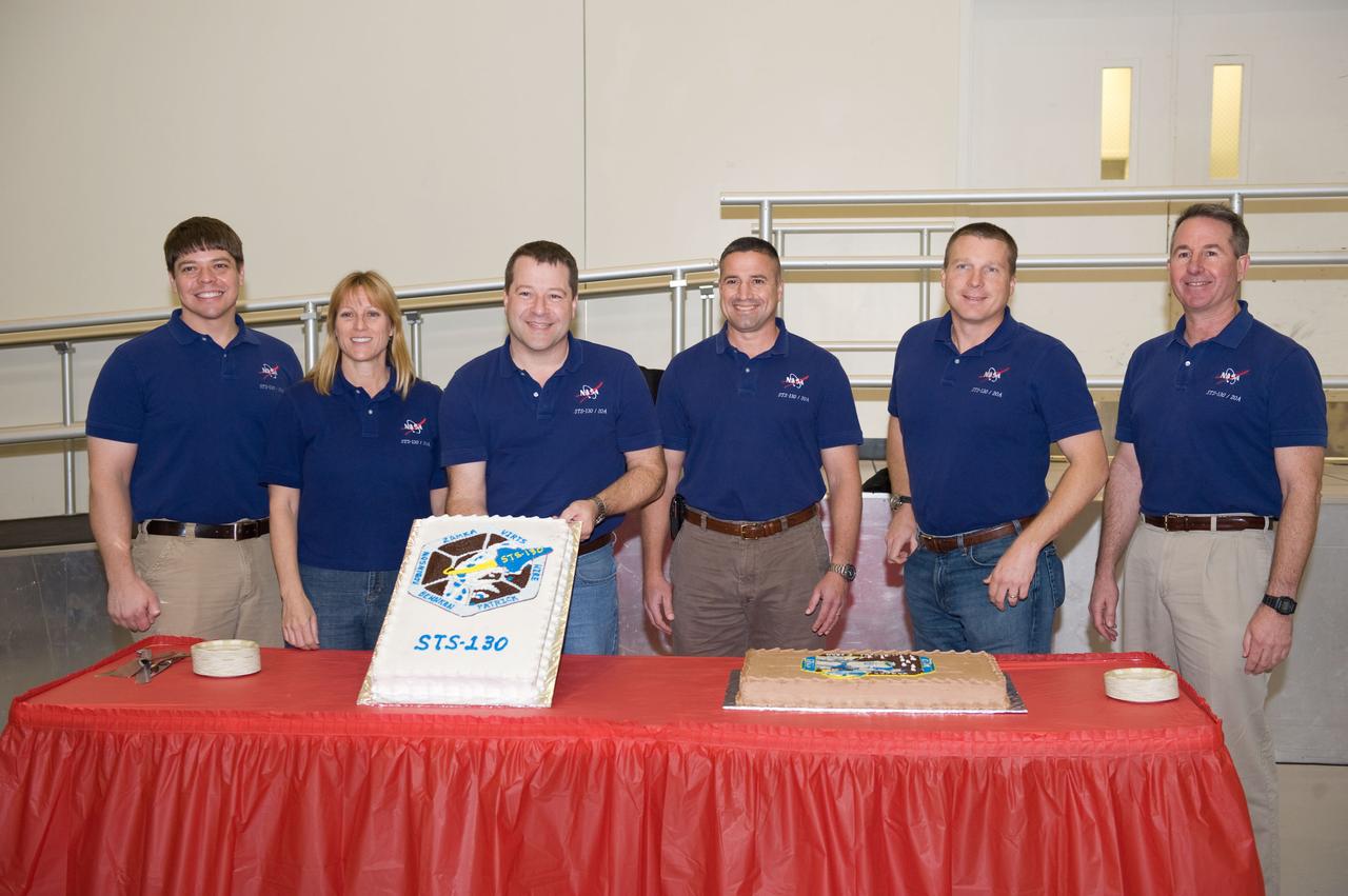 JSC2009-E-246180 (2 Dec. 2009) --- The STS-130 crew members celebrate the end of formal crew training with a cake-cutting ceremony in the Jake Garn Simulation and Training Facility at NASA's Johnson Space Center. Pictured from the left are astronauts Robert Behnken, Kathryn Hire, Nicholas Patrick, all mission specialists; George Zamka, commander; Terry Virts, pilot; and Stephen Robinson, mission specialist.