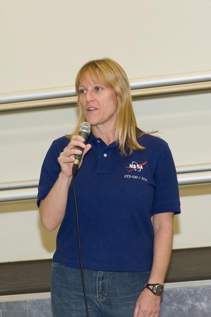 JSC2009-E-246186 (2 Dec. 2009) --- Astronaut Kathryn Hire, STS-130 mission specialist, speaks to a crowd during a cake-cutting ceremony in the Jake Garn Simulation and Training Facility at NASA's Johnson Space Center.