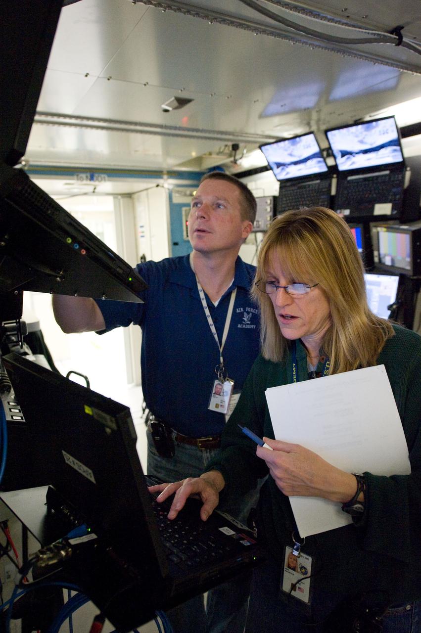 JSC2009-E-246716 (4 Dec. 2009) --- Astronauts Terry Virts, STS-130 pilot; and Kathryn Hire, mission specialist, participate in a robotics training session in an International Space Station mock-up/trainer in the Jake Garn Simulation and Training Facility at NASA's Johnson Space Center.