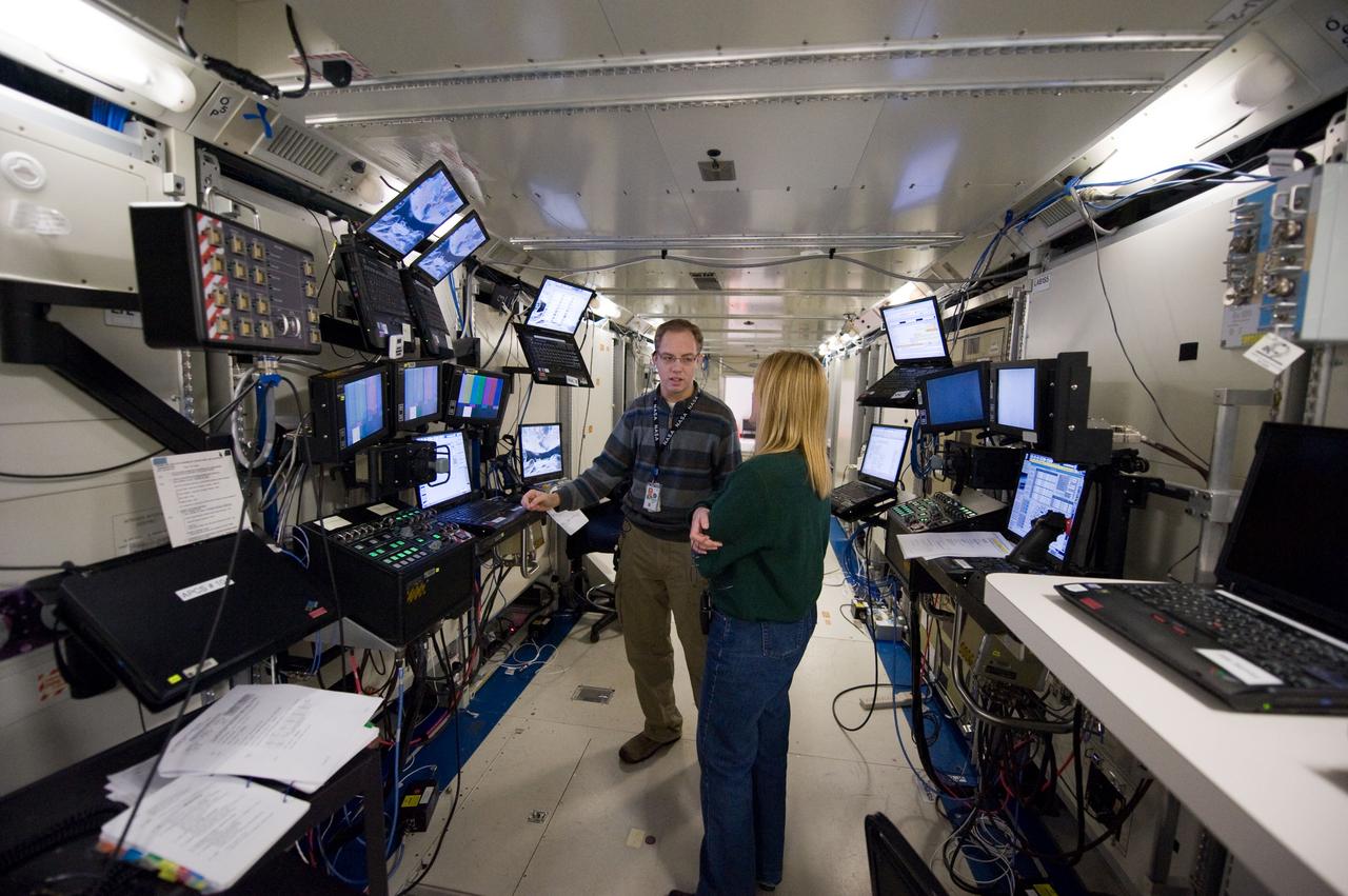 JSC2009-E-246718 (4 Dec. 2009) --- Astronaut Kathryn Hire, STS-130 mission specialist, participates in a robotics training session in an International Space Station mock-up/trainer in the Jake Garn Simulation and Training Facility at NASA's Johnson Space Center.