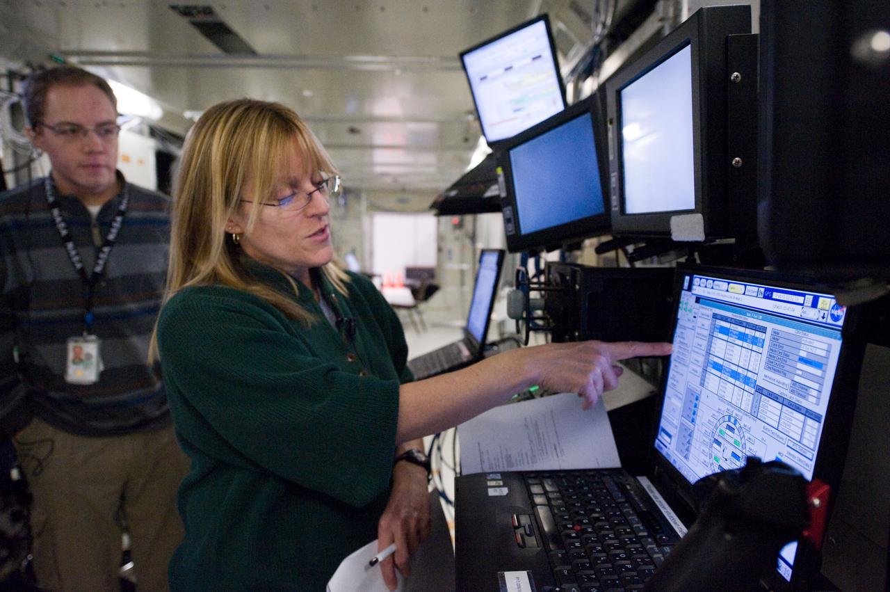 JSC2009-E-246724 (4 Dec. 2009) --- Astronaut Kathryn Hire, STS-130 mission specialist, participates in a robotics training session in an International Space Station mock-up/trainer in the Jake Garn Simulation and Training Facility at NASA's Johnson Space Center.