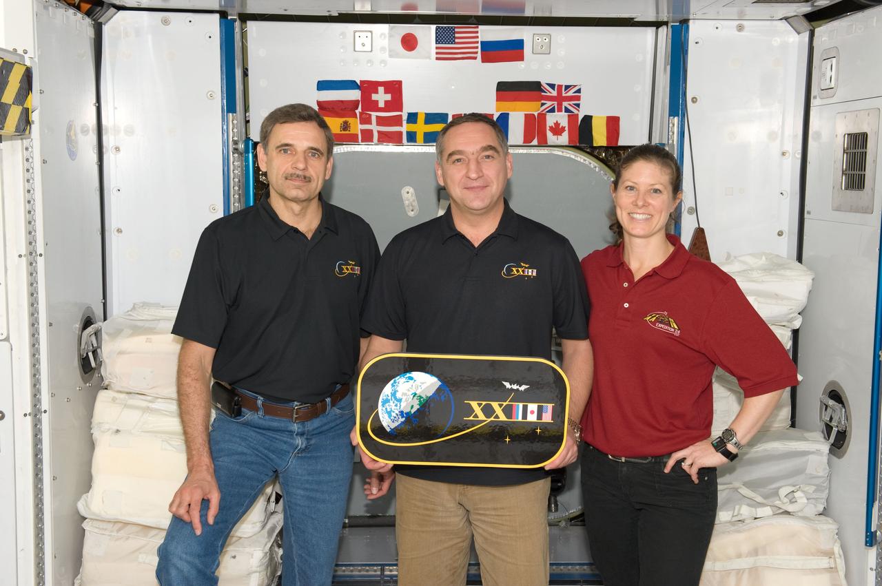 PHOTO DATE: 12-08-09 LOCATION: Bldg 9NW, ISS Mockups SUBJECT: Expedition 23 crew with the training team. PHOTOGRAPHER: James Blair