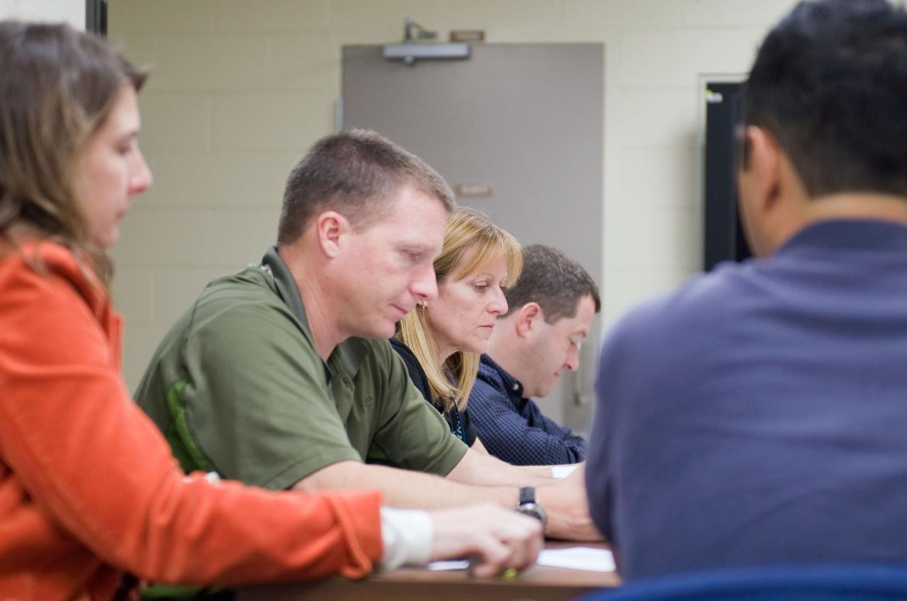 JSC2009-E-258395 (8 Dec. 2009) --- Astronaut Terry Virts (foreground), STS-130 pilot; along with astronauts Kathryn Hire and Nicholas Patrick, both mission specialists, participate in a training session in the Space Vehicle Mock-up Facility at NASA's Johnson Space Center.