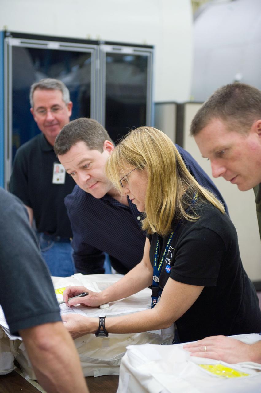 JSC2009-E-258401 (8 Dec. 2009) --- Astronaut Terry Virts (right), STS-130 pilot; along with astronauts Kathryn Hire, Nicholas Patrick and Stephen Robinson, all mission specialists, participate in a training session in the Space Vehicle Mock-up Facility at NASA's Johnson Space Center.