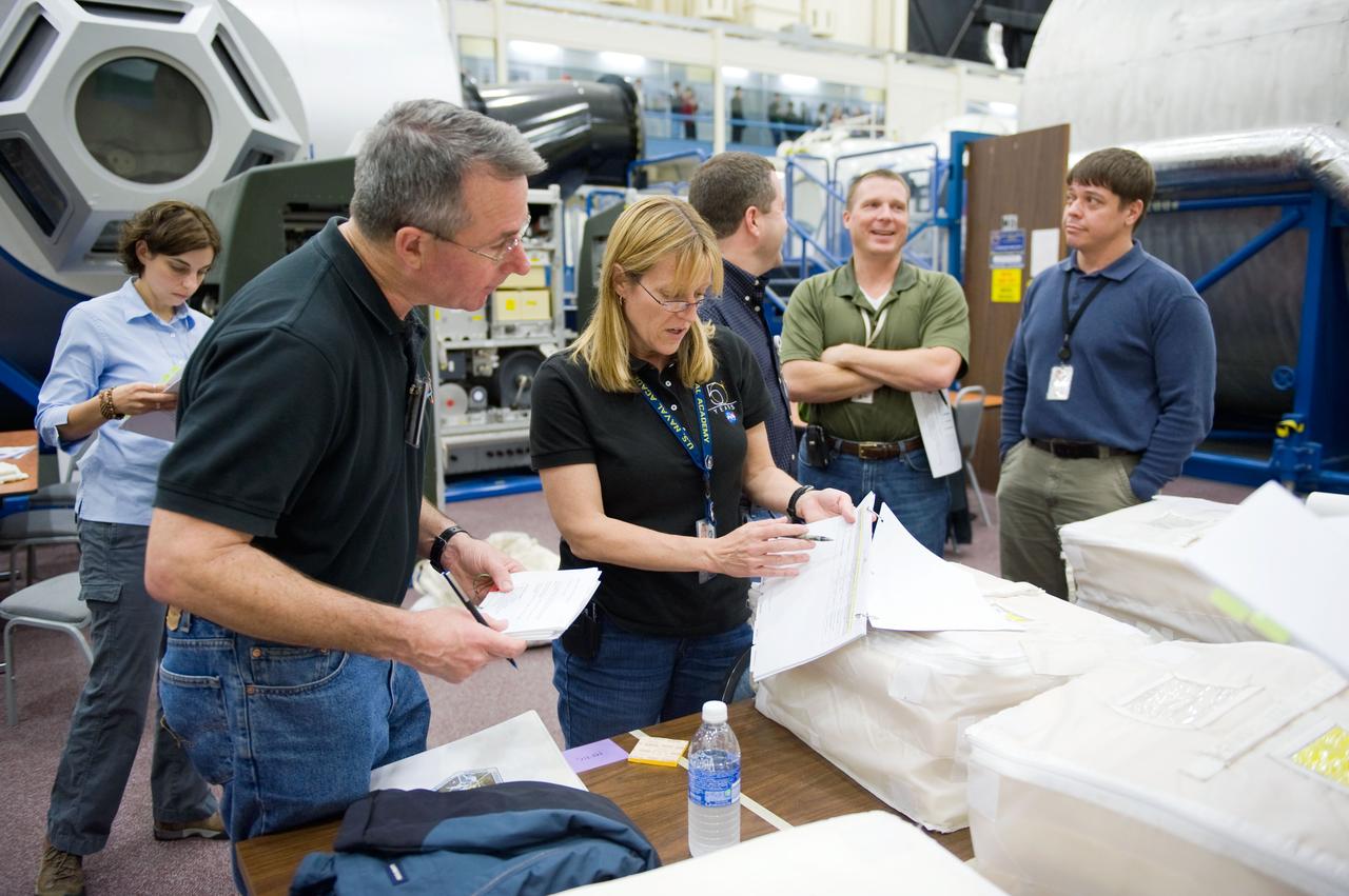JSC2009-E-258403 (8 Dec. 2009) --- Astronaut Terry Virts (second right), STS-130 pilot; along with astronauts Stephen Robinson (left), Kathryn Hire, Nicholas Patrick and Robert Behnken, all mission specialists, participate in a training session in the Space Vehicle Mock-up Facility at NASA's Johnson Space Center.